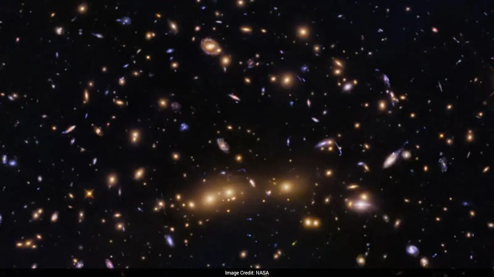 NASA Shares Image Of Merging Galaxy Clusters Helping Decode Dark Matter