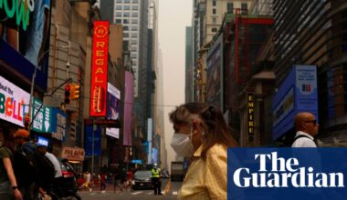 ‘My eyes were stinging’: New Yorkers navigate smoky air and soaring temperatures | New York