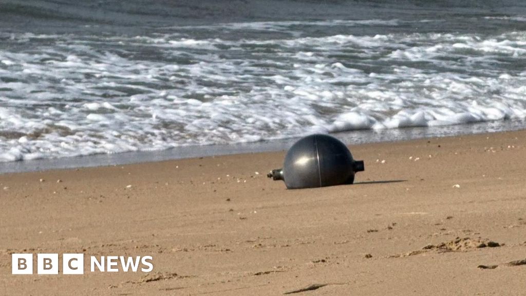Australia probes mystery space balls that washed up on beach - BBC