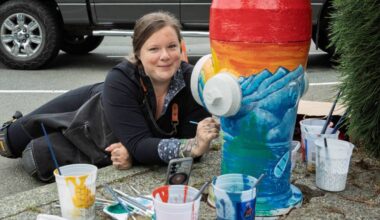 Mandy Phoenix works on her fire hydrant design at Harbour Quay on Friday, July 3. Phoenix was one of more than half a dozen artists chosen to participate in an HGTV Home Town Takeover community art project, repainting hydrants in Harbour Quay and up Argyle Street in vibrant colours. The artists’ inspiration for each design will be revealed as part of the reality TV show premiering in the fall. See more on page A7. (Roland Smith/ Alberni Valley News)