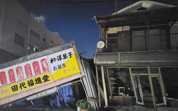 A Japanese and Western confectionery shop building lies collapsed following an earthquake in Yatsushiro City, Kumamoto Prefecture, Japan, on July 28, 2026. According to the Japan Meteorological Agency, the earthquake struck Kumamoto Prefecture around 4:27 p.m. on July 28, measured a maximum of 7 on Japan's seismic intensity scale, occurred at a depth of about 10 kilometers, and had an estimated magnitude of 7.1. ( The Yomiuri Shimbun ) (Photo by Kazuhiro Shiraishi / The Yomiuri Shimbun via AFP)