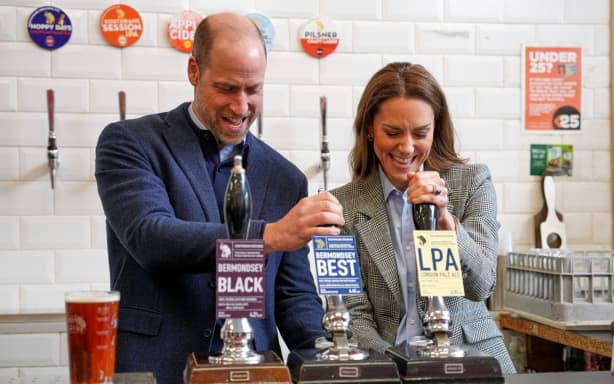 Britain's Prince William, Prince of Wales and Britain's Catherine, Princess of Wales, pull pints during a visit to the Southwark Brewing Company at the Bermondsey Beer Mile in London on March 12, 2026. (Photo by Kin Cheung / POOL / AFP)