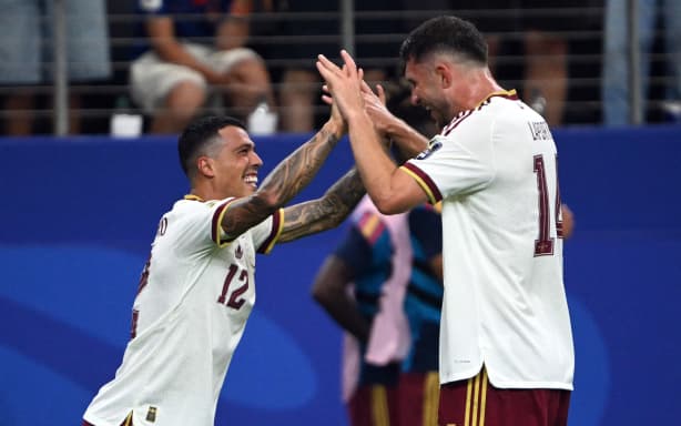 Spain's defender #12 Pedro Porro (L) celebrates with Spain's defender #14 Aymeric Laporte  scoring his team's second goal during the 2026 World Cup football tournament semi-final match between France and Spain at the Dallas Stadium in Arlington on July 14, 2026.  (Photo by MAURO PIMENTEL / AFP)