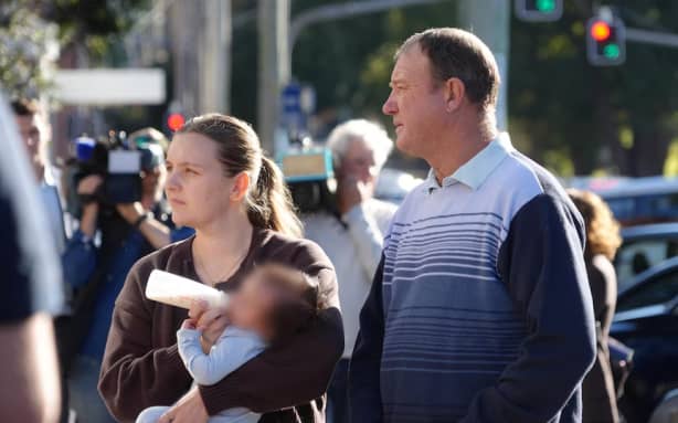 Jana Armstrong's sister Faith Isaacs outside court with her sister's child, with her father and with friends.