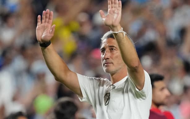 Switzerland coach Murat Yakin applauds fans after the match on Saturday.