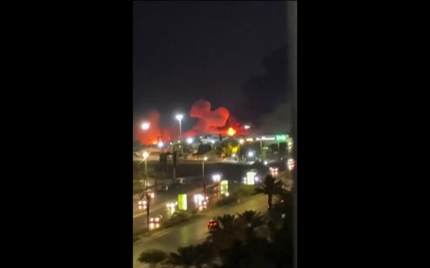 This frame grab made from a UGC video footage of an unknown source posted on social media on July 8 show explosions going off in Iran's major port city of Bandar Abbas. The United States launched extensive strikes on Iran over attacks on ships in the vital Strait of Hormuz, triggering a wave of reprisals on July 8 that Iran's Guards said targeted US bases in the Gulf. Both sides reported hitting dozens of targets in renewed hostilities, which have placed fresh strain on an interim deal to end the Middle East war and pushed oil prices to their highest level in two weeks. (Photo by various sources / AFP) /