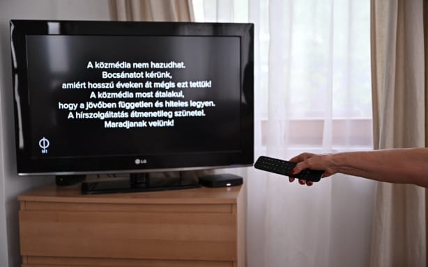 A message on a tv screen at a family home in Agard, Hungary on July 7, 2026, as the main state channel, the M1 informs viewers of the temporary suspension of news broadcasts in all state broadcasters. The message reads "The public state media cannot lie. We apologize for doing this for so many years! The public media is now transforming itself to be independent and credible in the future. News service is temporarily suspended! Stay tuned!."