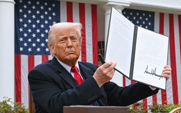 US President Donald Trump holds a signed executive order after delivering remarks on reciprocal tariffs during an event in the Rose Garden entitled "Make America Wealthy Again" at the White House in Washington, DC, on April 2, 2025. Trump geared up to unveil sweeping new "Liberation Day" tariffs in a move that threatens to ignite a devastating global trade war. Key US trading partners including the European Union and Britain said they were preparing their responses to Trump's escalation, as nervous markets fell in Europe and America.