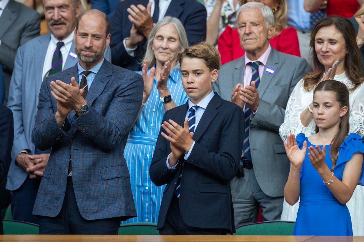 Prince George, Prince William and Princess Charlotte share a cheerful family moment while watching the Wimbledon final together.