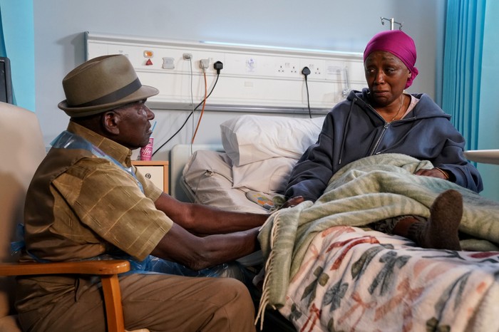 568900,TITLE:Eastenders Patrick comforts Denise by her bedside in EastEnders