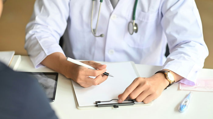 A doctor consulting a patient, who may have tried to outsmart their doctors and failed.