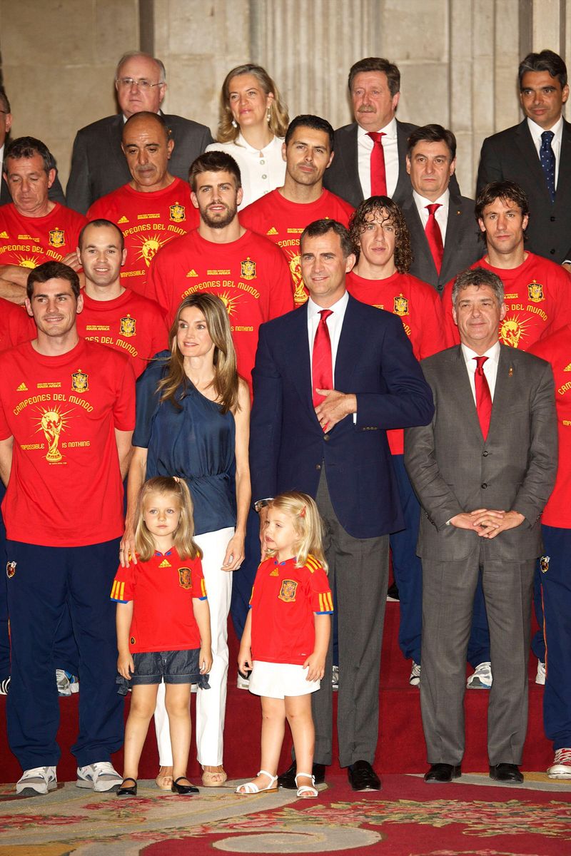 Iker Casillas lets Princess Leonor and Infanta Sofía get their first close look at the FIFA World Cup trophy after Spain's historic 2010 victory.