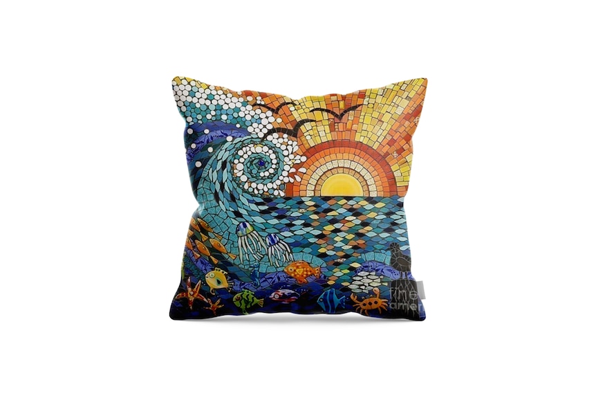 A pillow with the image of sunset wave, including a watermark that seems to be printed on the pillow.