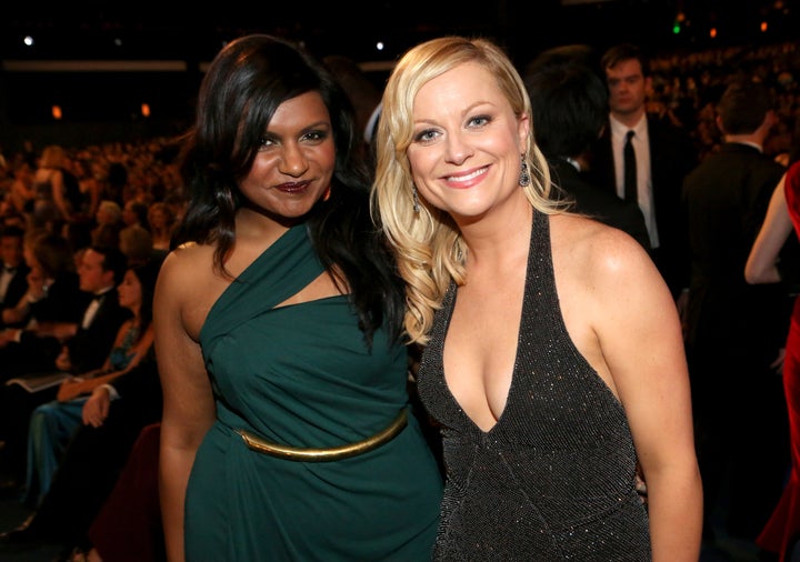 Kaling and Poehler in the audience at the 64th Primetime Emmy Awards in 2012.