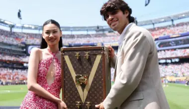 South Korean actress Hoyeon (left) was joined by Spanish tennis star Carlos Alcaraz as the pair carried the World Cup trophy in a specially designed Louis Vuitton case.