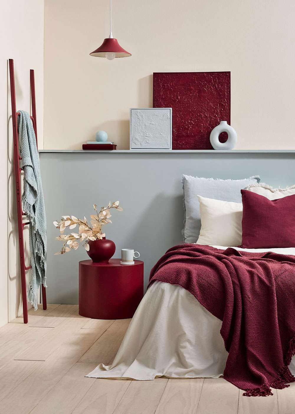 Keeping rooms uncluttered and simple allows the red to shine rather than compete. Wall and planter in Resene Lonestar, floor and vase in Cinder, mask decor in Vesuvius. Chair from Good Form, rug from Baya. Project Amber Armitage. Image Wendy Fenwick.