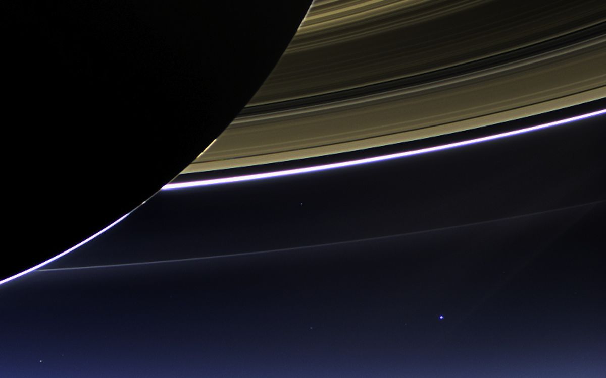 This rare space wallpaper taken on July 19, by NASA's Cassini spacecraft shows Saturn's rings and our planet Earth and its moon in the same frame.
