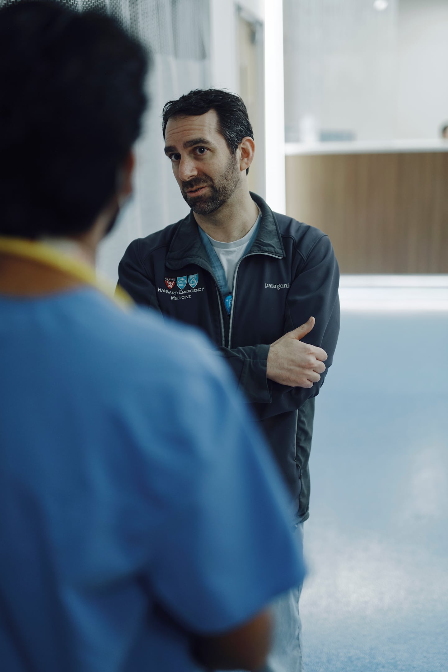 Faust speaks with a resident at Brigham and Women’s Hospital.