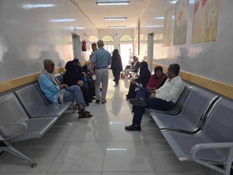 people waiting on chairs in a hospital