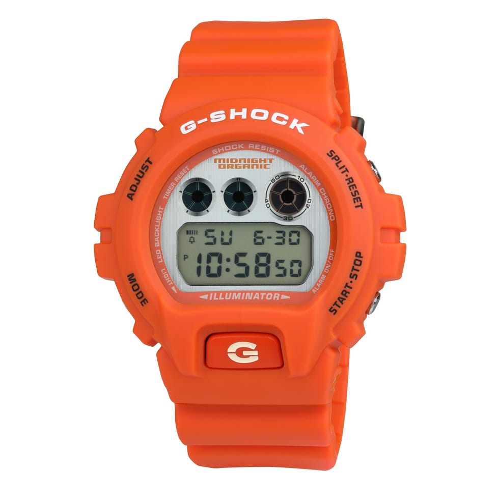 orange g shock digital watch with date and time display.