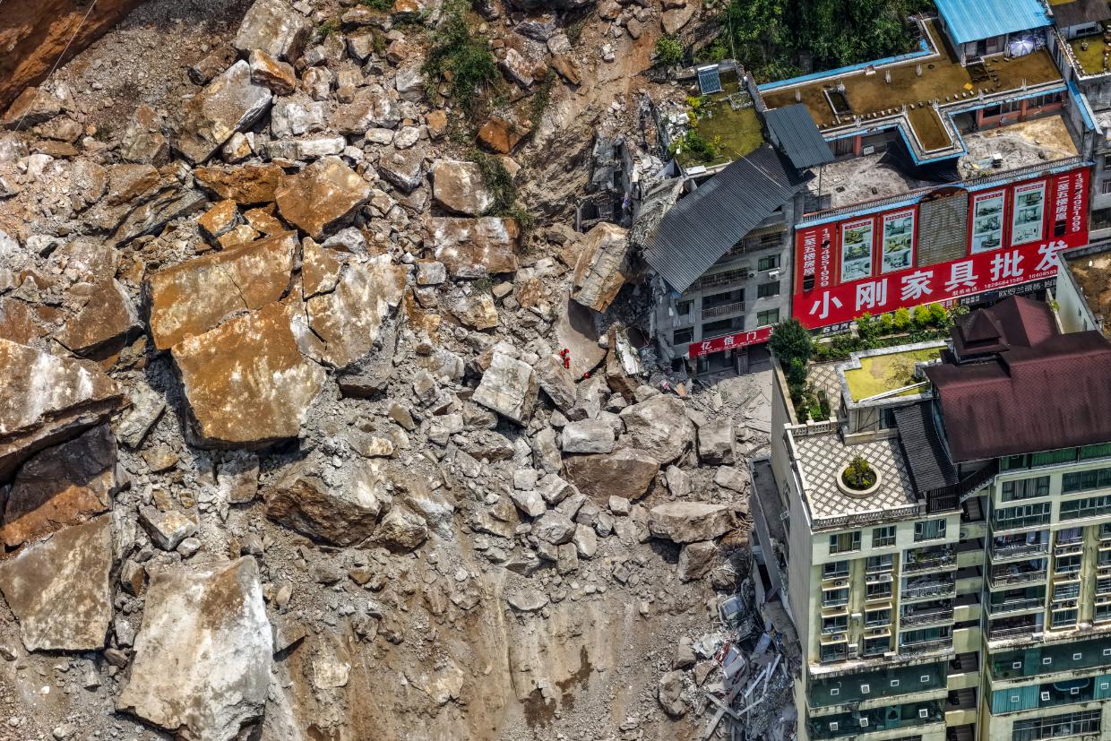 Aerial video shows immediate aftermath of huge landslide that buried houses in China - Stuff