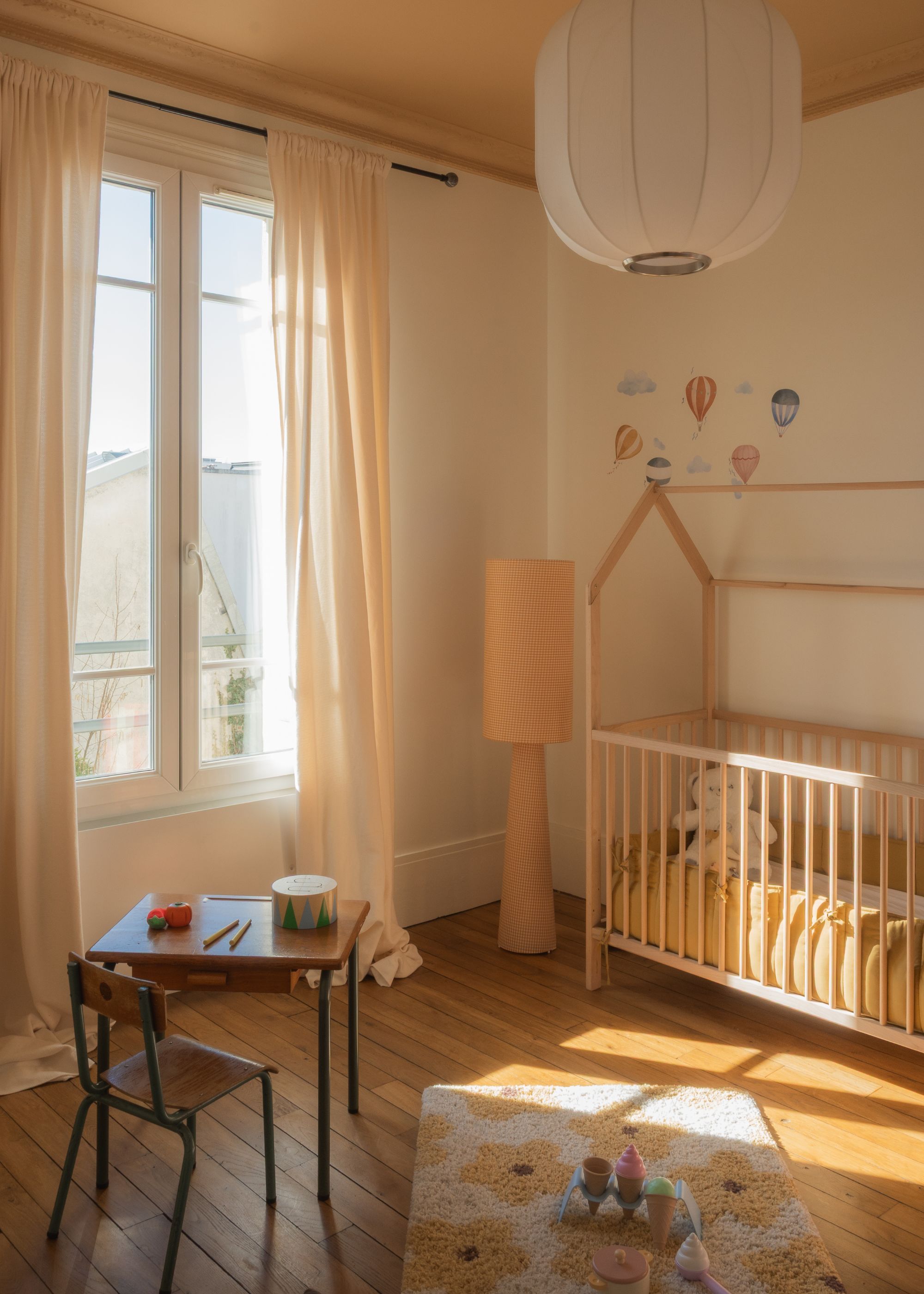 A kids bedroom in peach shades with custom furniture