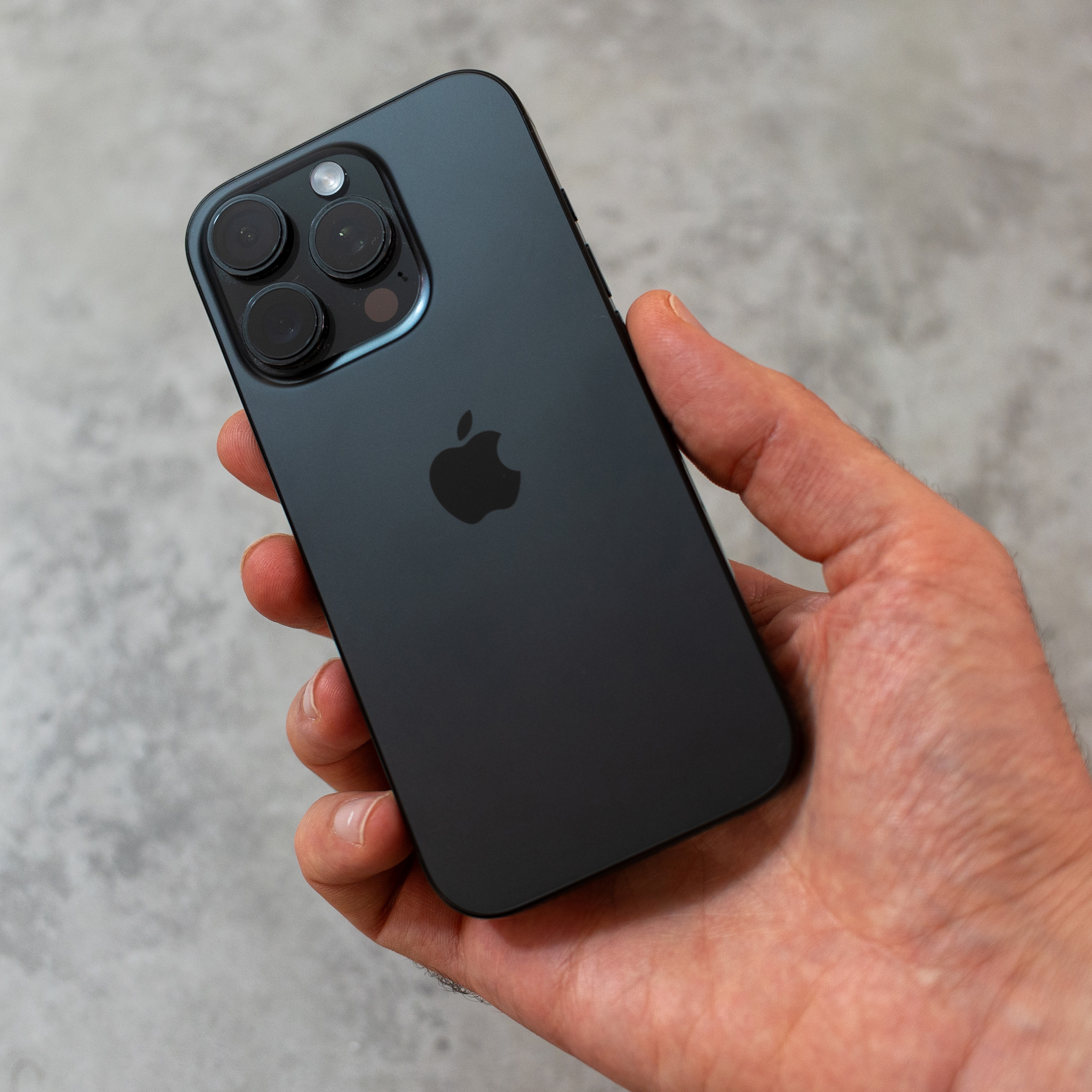 Apple iPhone 16 Pro held in a hand