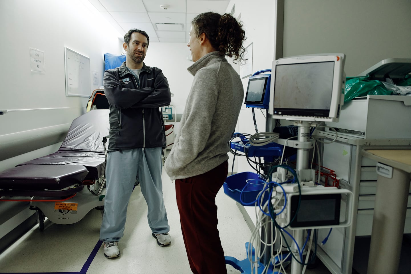 Dr. Jeremy Faust speaks with a colleague at Brigham and Women’s Hospital.