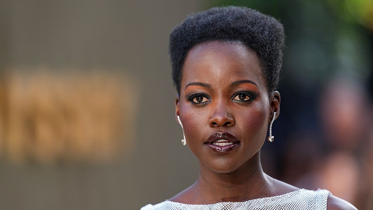 Lupita Nyong'o poses for photographers at the premiere of The Odyssey in London.