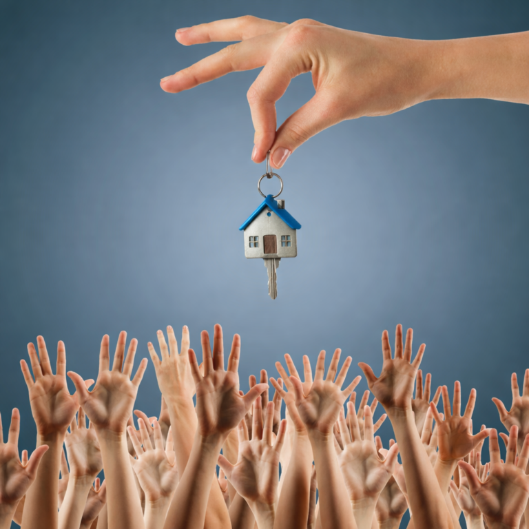 Hand holding a house key above a crowd of raised hands symbolising competition in the rental market
