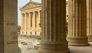 The exterior of the Philadelphia Museum of Art is reflected through the windows of the front entrance lobby on Tuesday, July 14, 2026, in Philadelphia.