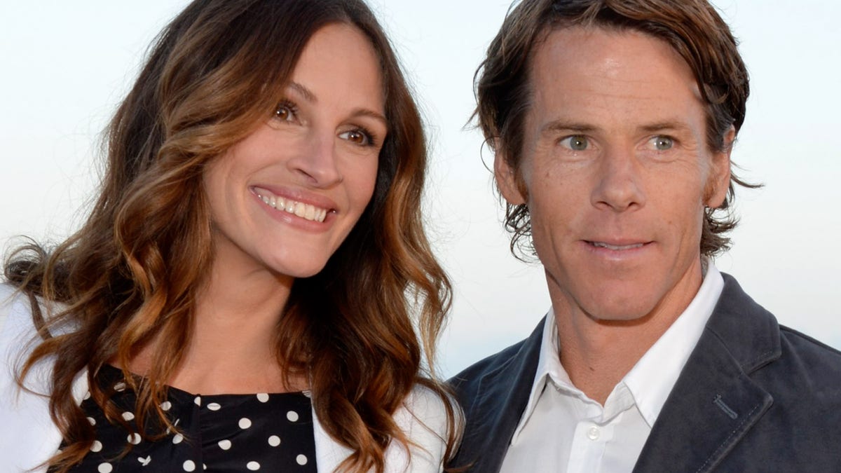 Julia Roberts and Daniel Moder standing together at an event venue.