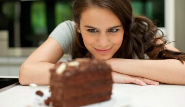 woman stares at chocolate layer cake