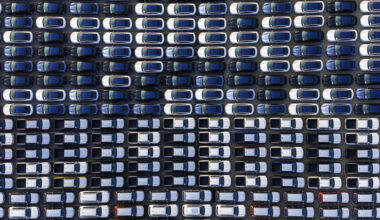 Image of vast rows of vehicles parked for storage.