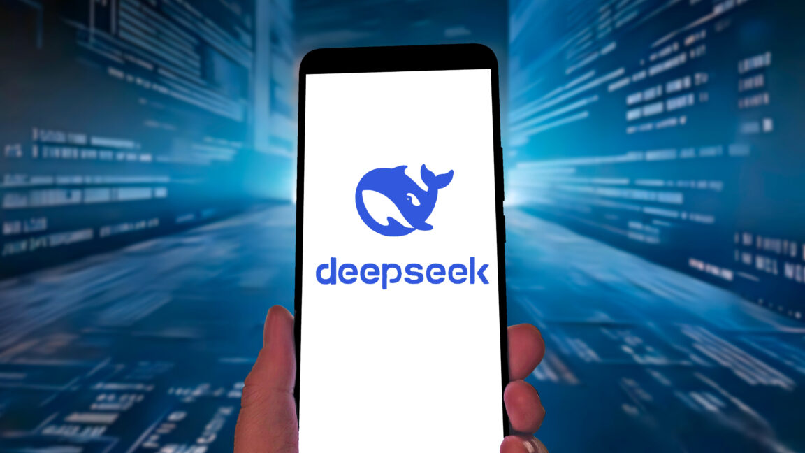 DeepSeek logo on a smartphone against a blue streaming-code tech-ish background.