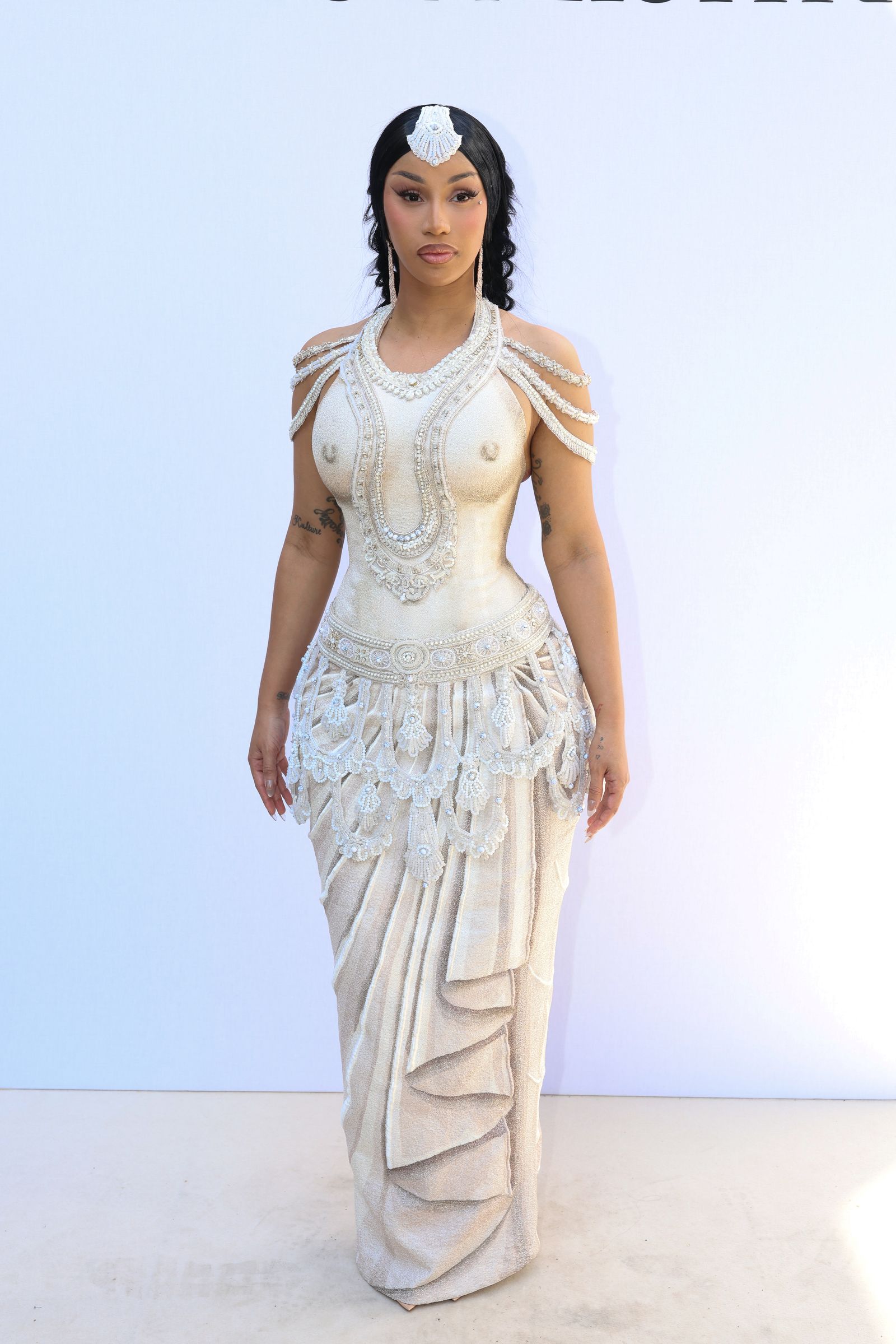Image may contain Cardi B Clothing Dress Adult Person Evening Dress Formal Wear Fashion Gown and Wedding