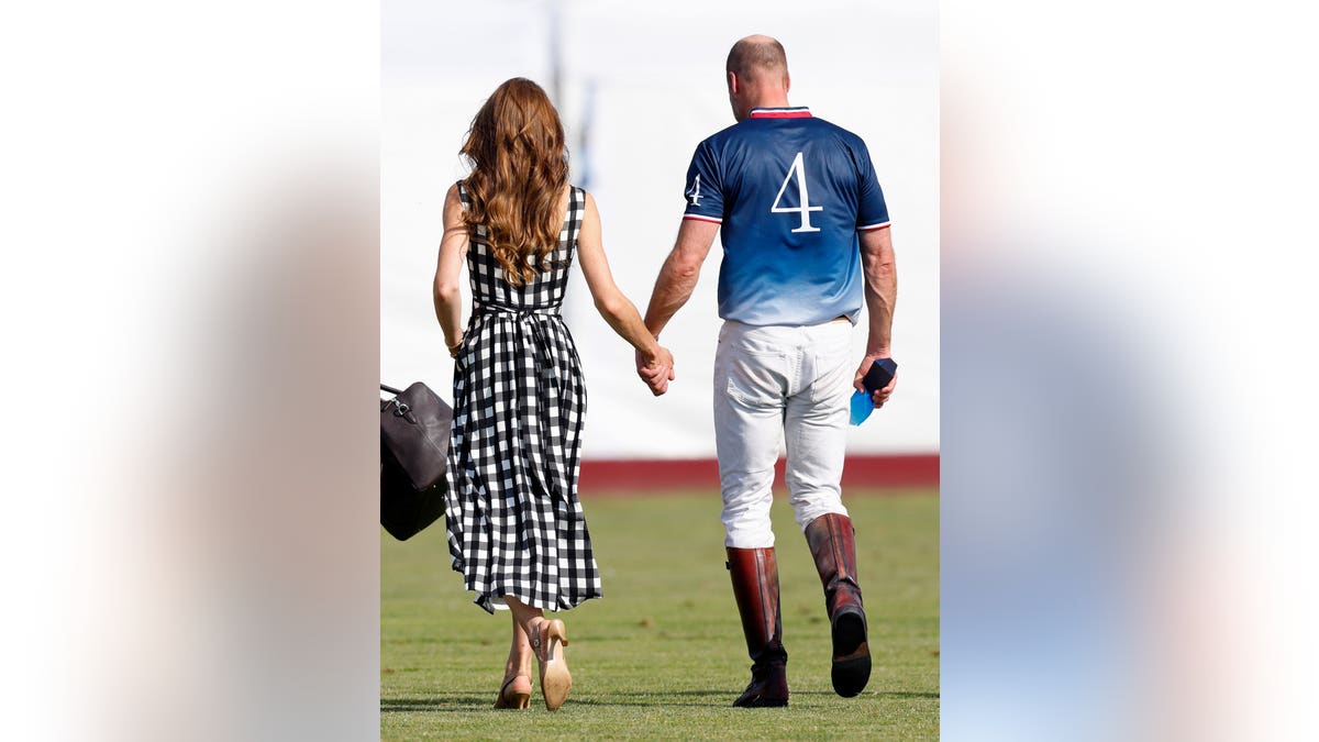 Catherine, Princess of Wales and Prince William hold hands at a polo event in Windsor, England.