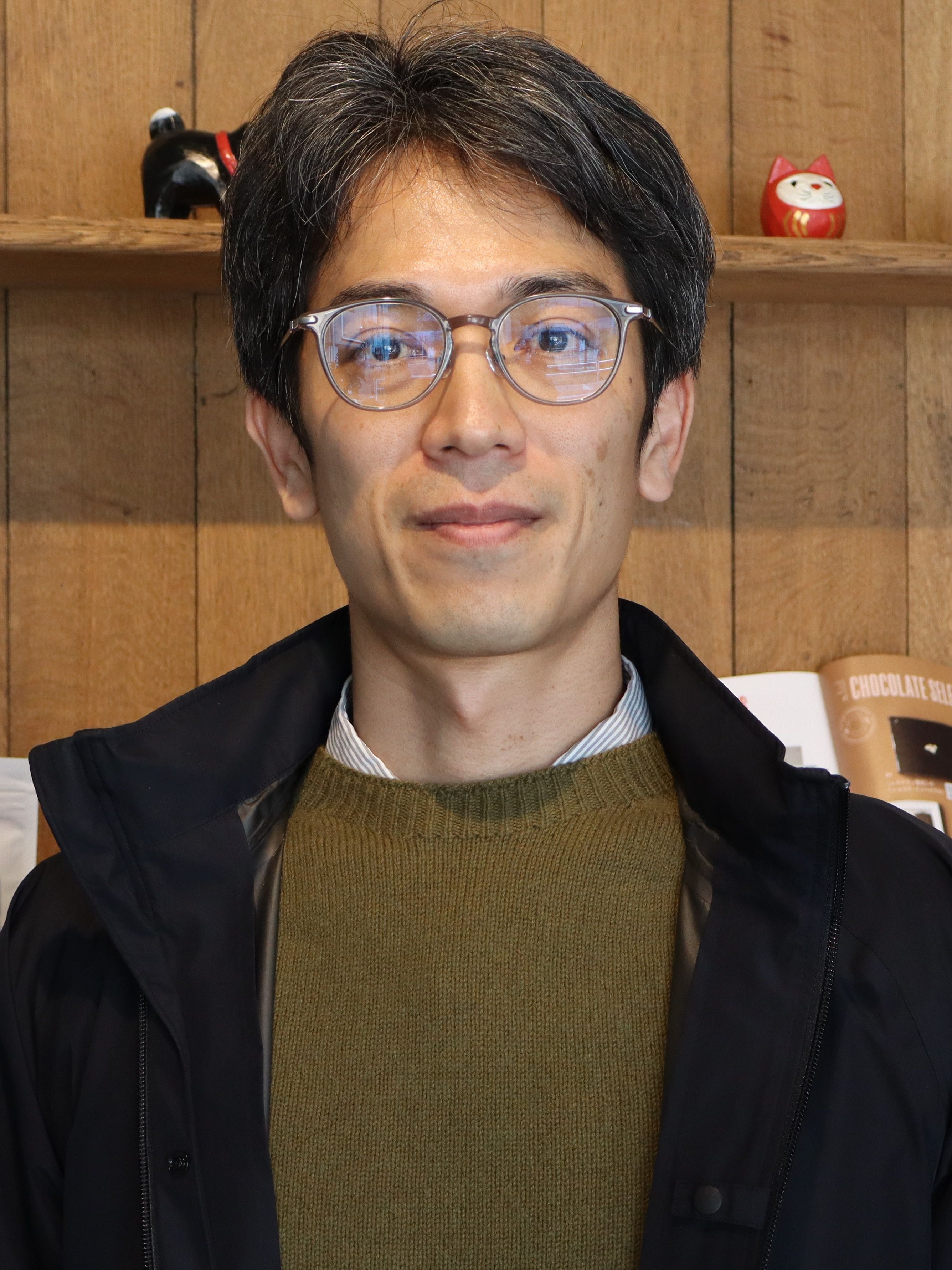 photo of a smiling man with glasses and short, salt-and-pepper hair