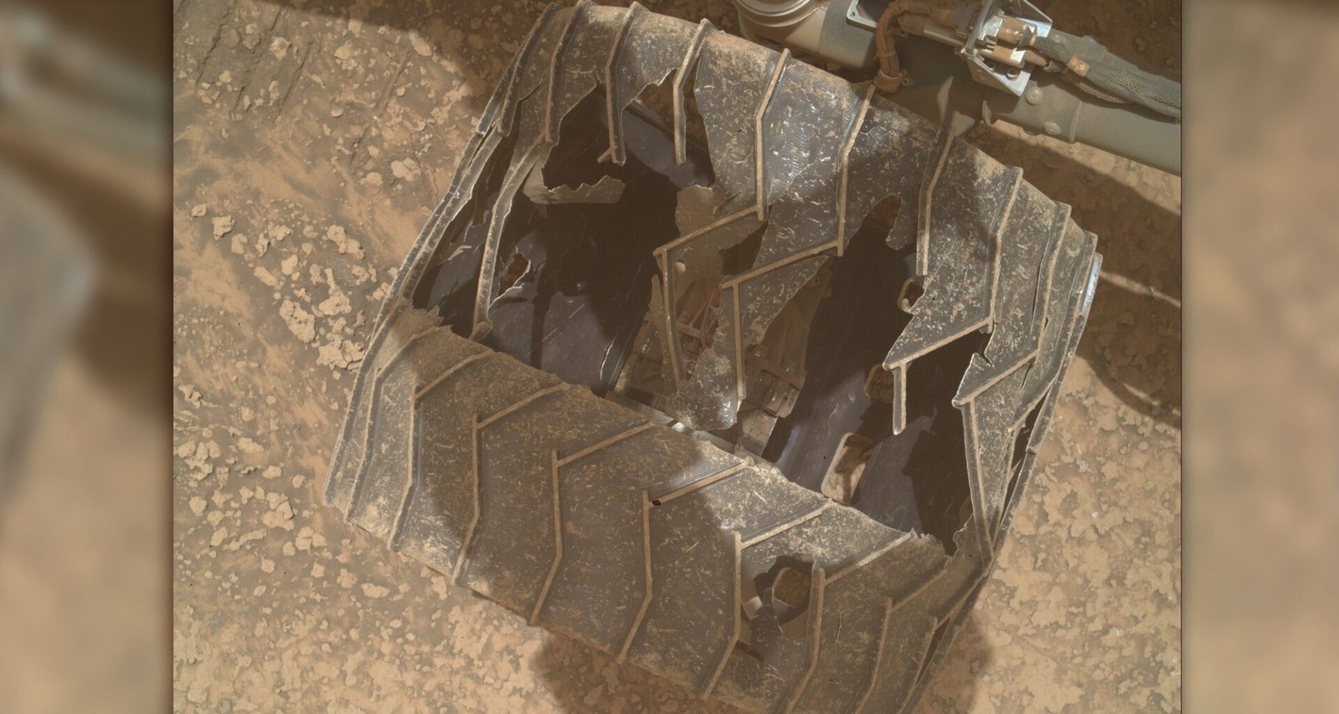 Curiosity Mars rover inspects cracked wheel photo of the day for July 24, 2026
