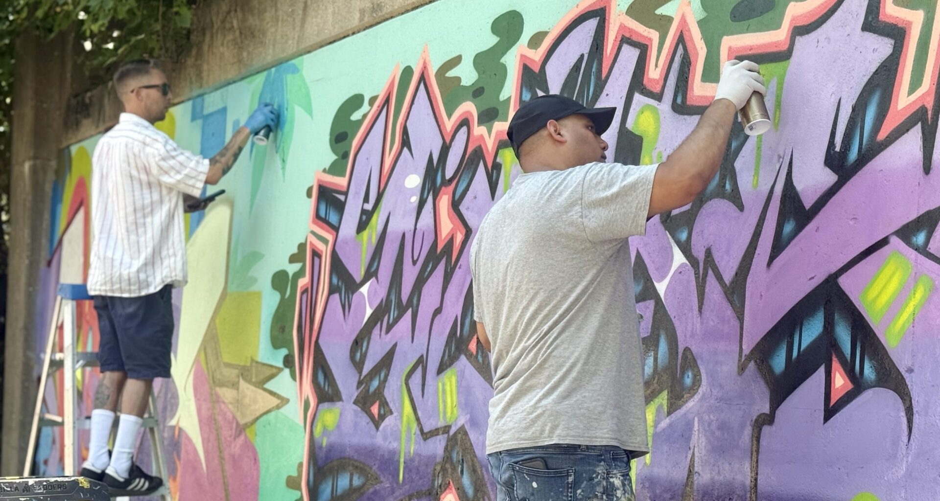 Graffiti artists complete mural ahead of permission wall opening