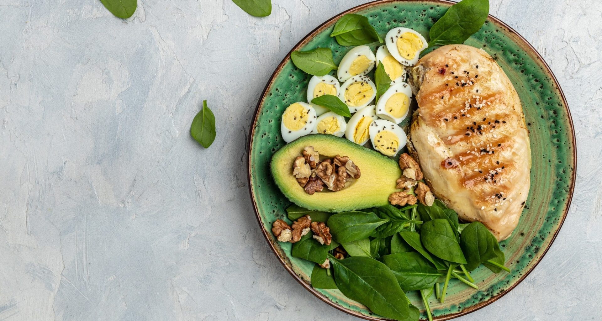 Keto diet: chicken fillet with salad, eggs, avocado and walnuts