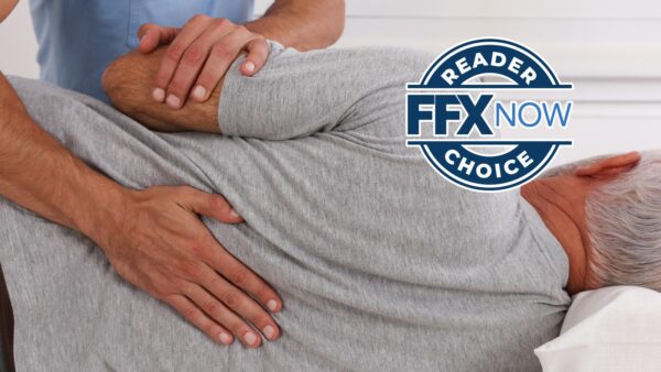 Therapist applies back therapy to an elderly man lying on his side, logo badge overlay reads 'READER FFX NOW CHOICE'.