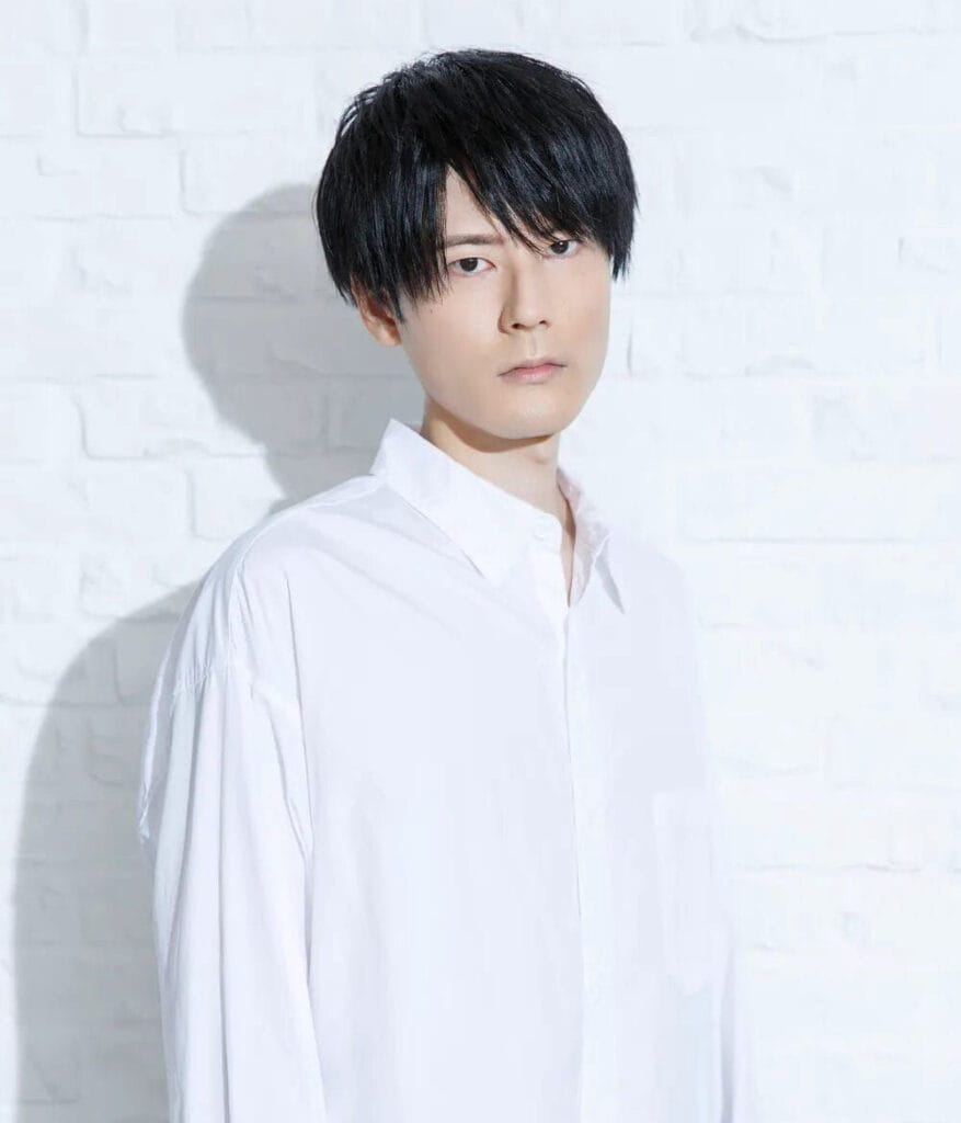 Headshot for Koki Uchiyama, who is wearing a white shirt and standing in front of a white brick wall