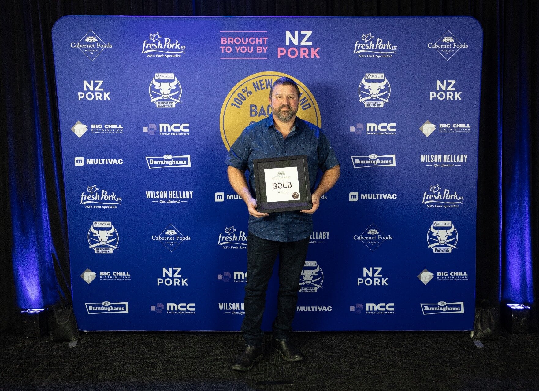 Jason from Kiwi Fresh Meats accepting the award. Photo / Retail Meat NZ
