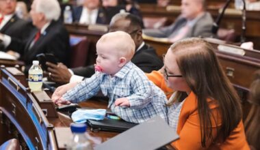 Pennsylvania Representative Jennifer O'Mara (D., Delaware County) with her daughter, Katherine, in the House chambers in Harrisburg in 2023. O'Mara suffered from postpartum depression after giving birth to her daughter. She was unable to do a virtual therapy session with her counselor while out of state. She's helped pass a bill that will change that.