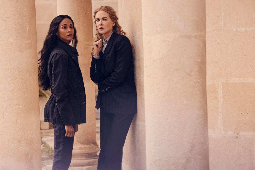 Lioness still: Zoë Saldaña and Nicole Kidman stood amongst cream pillars