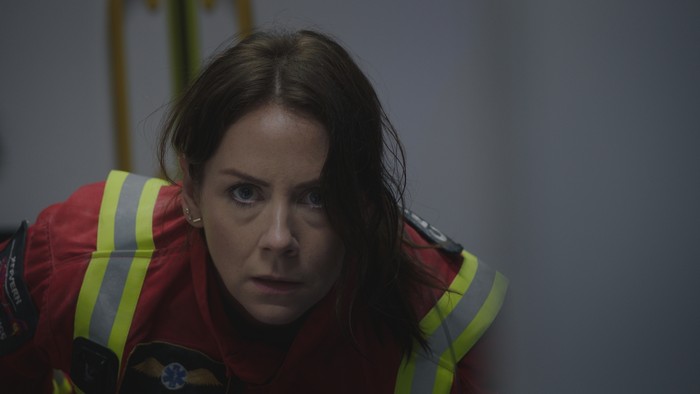 S40 Ep34 Stevie Stevie crouching in the back of an ambulance in a scene from Casualty