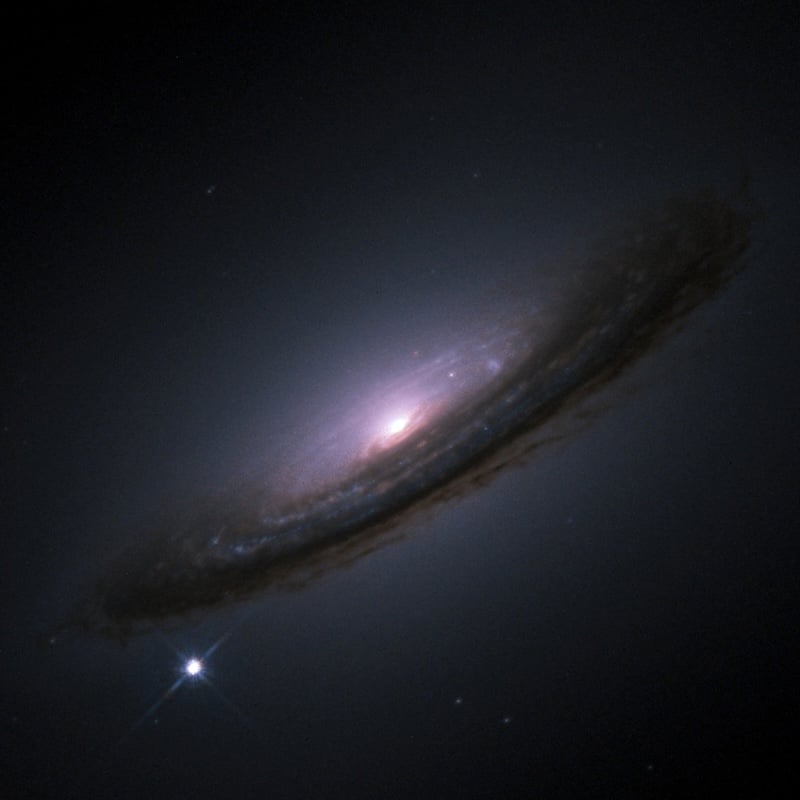 SN 1994D (bright spot on the lower left), a Type Ia supernova within its host galaxy, NGC 4526 (Credit : NASA/ESA)