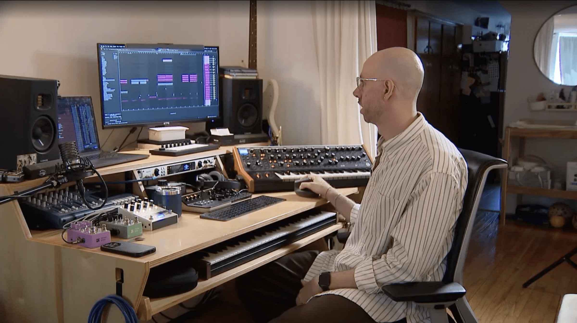 Zach Golden, the composer of the 2026 World Cup theme at his studio desk.