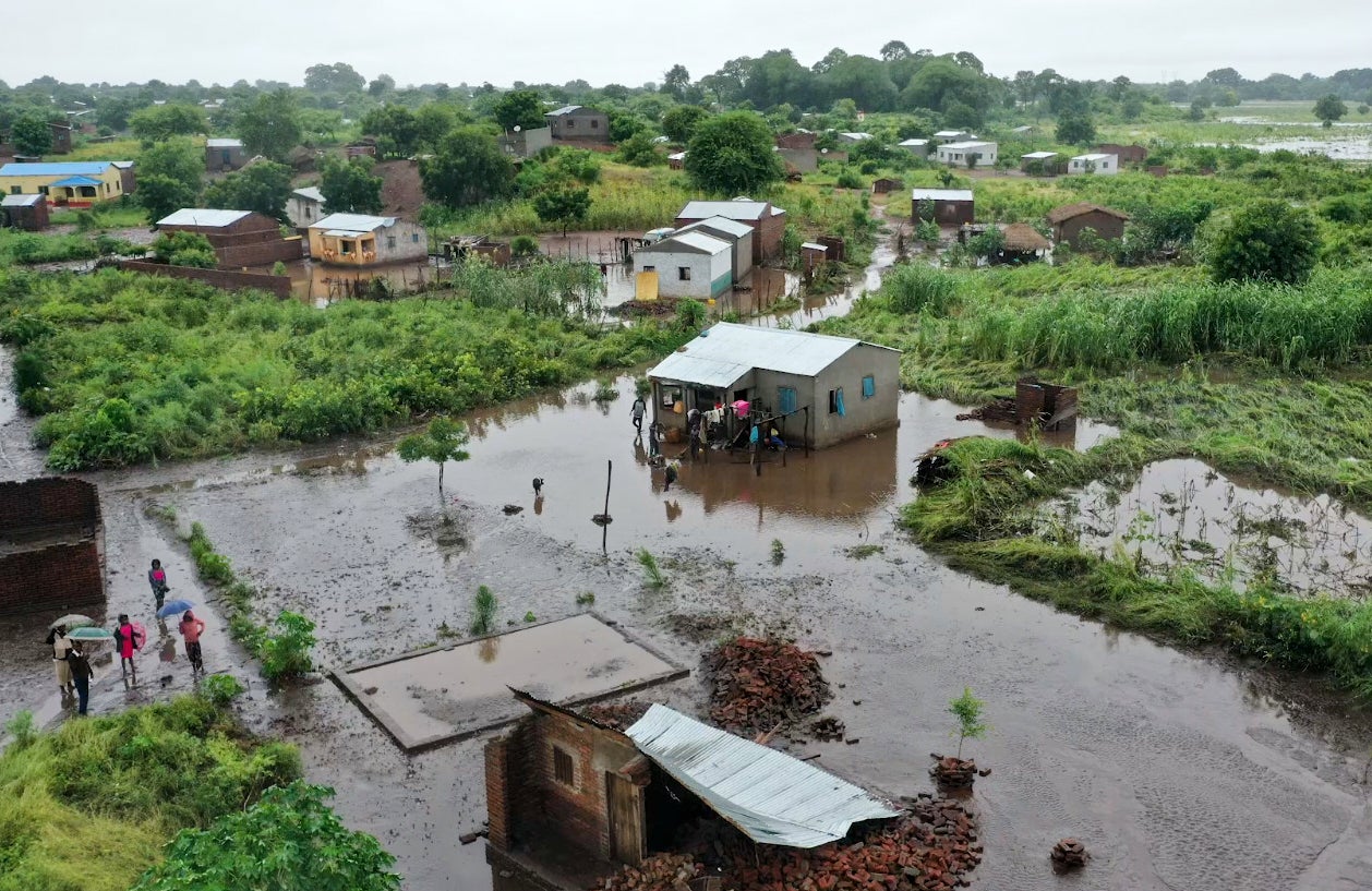 Villagers inspect the damage after the devastating floods that hit Mozambique earlier this year